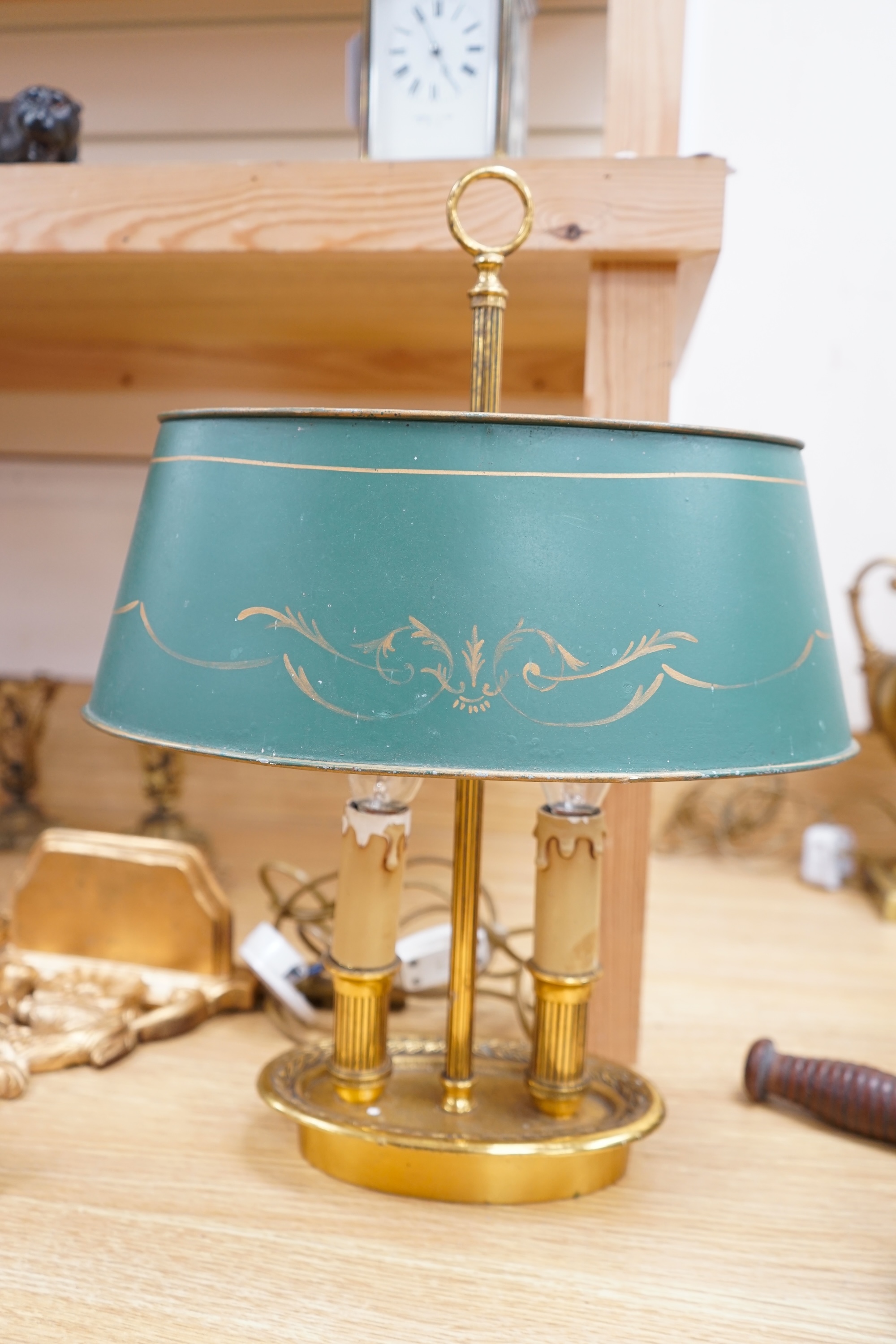 A French two light brass table lamp with toleware shade, 42cm high. Condition - some ware to toleware shade